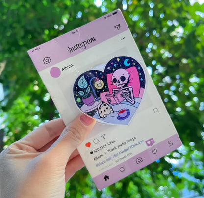 Skeleton & Cat Magnetic Phone Stand: Cute Heart-Shaped Phone Grip, Nighttime Skeleton Reading with Cat, Kawaii Magsafe Phone Holder