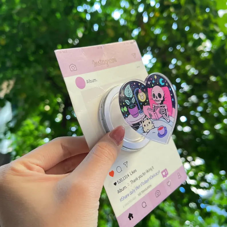 Skeleton & Cat Magnetic Phone Stand: Cute Heart-Shaped Phone Grip, Nighttime Skeleton Reading with Cat, Kawaii Magsafe Phone Holder