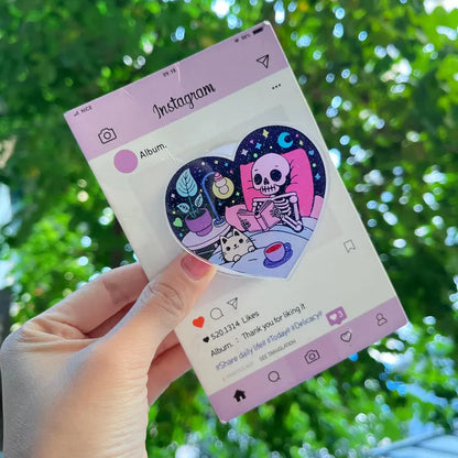 Skeleton & Cat Magnetic Phone Stand: Cute Heart-Shaped Phone Grip, Nighttime Skeleton Reading with Cat, Kawaii Magsafe Phone Holder