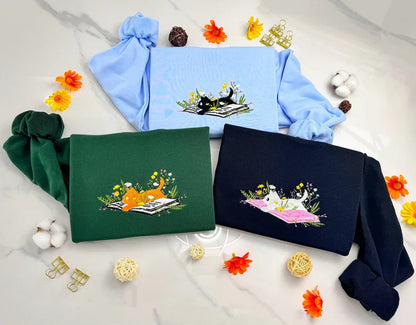 Cute Cat Lying On Book With Flower Embroidered Book Sweatshirt