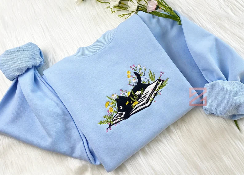 Cute Cat Lying On Book With Flower Embroidered Book Sweatshirt