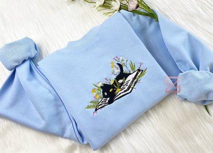Cute Cat Lying On Book With Flower Embroidered Book Sweatshirt