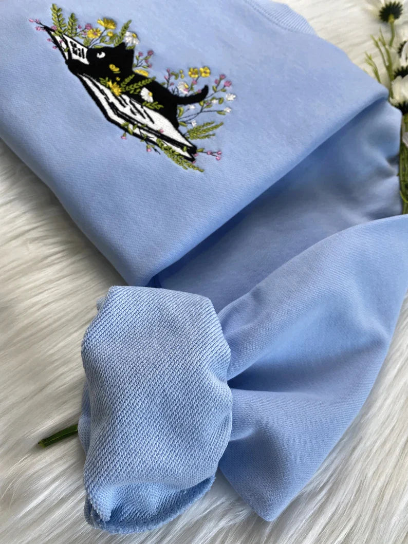 Cute Cat Lying On Book With Flower Embroidered Book Sweatshirt